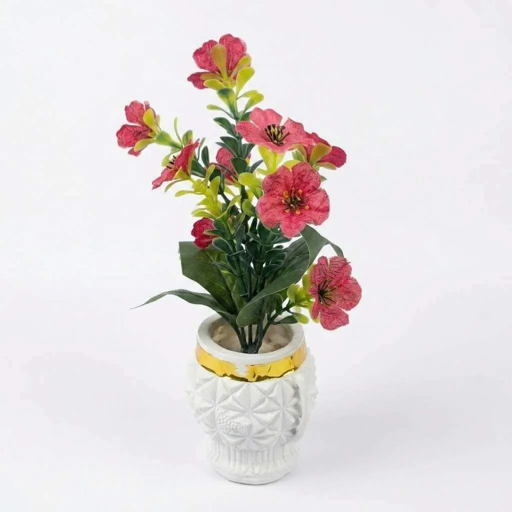 Artificial flower pot on bookshelf table