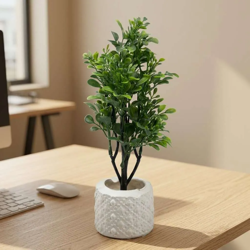 Faux plant in white textured ceramic pot