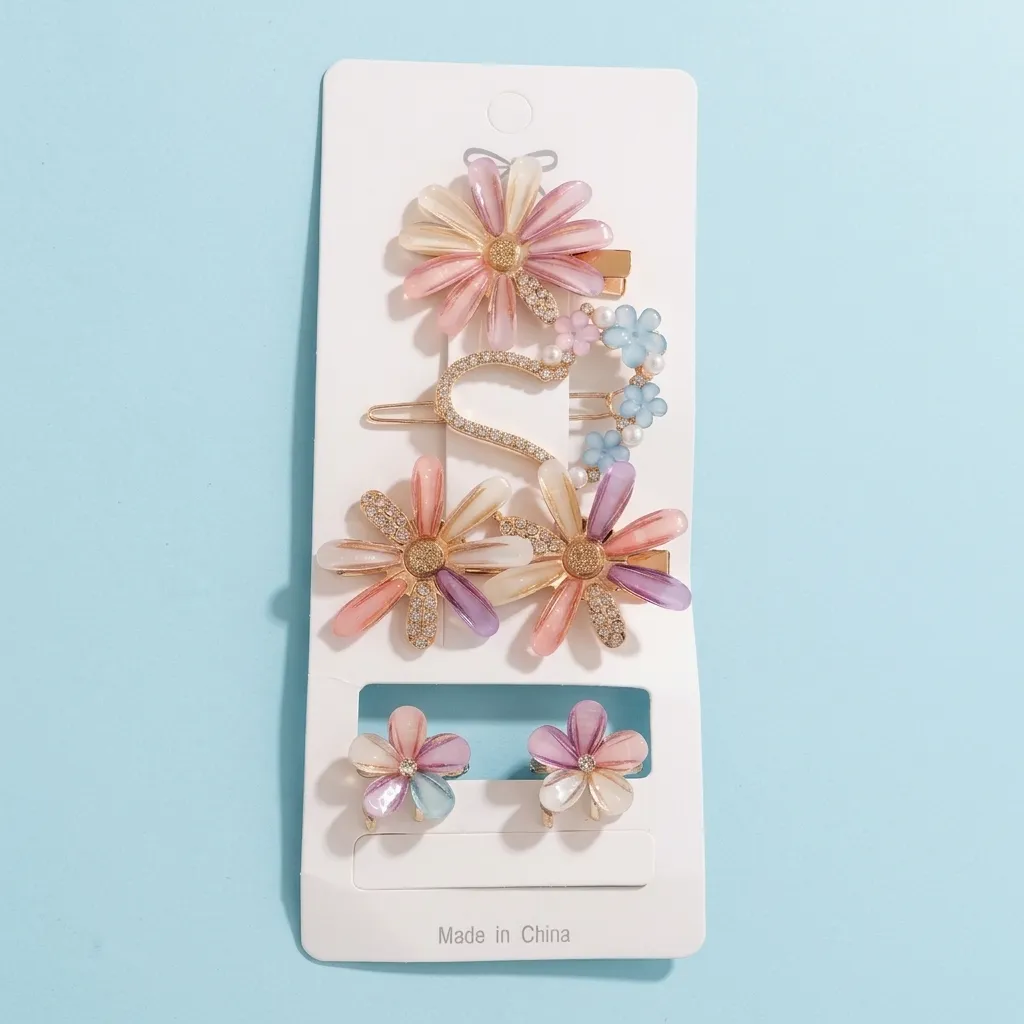 Flower hair clips set blue background
