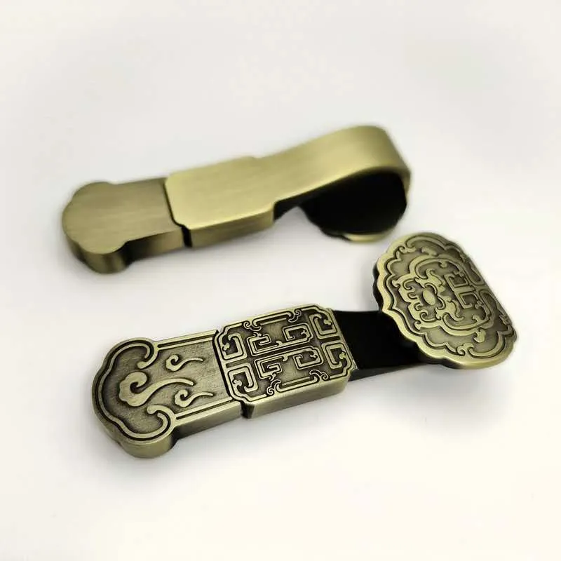 Gold USB drive with red tassel