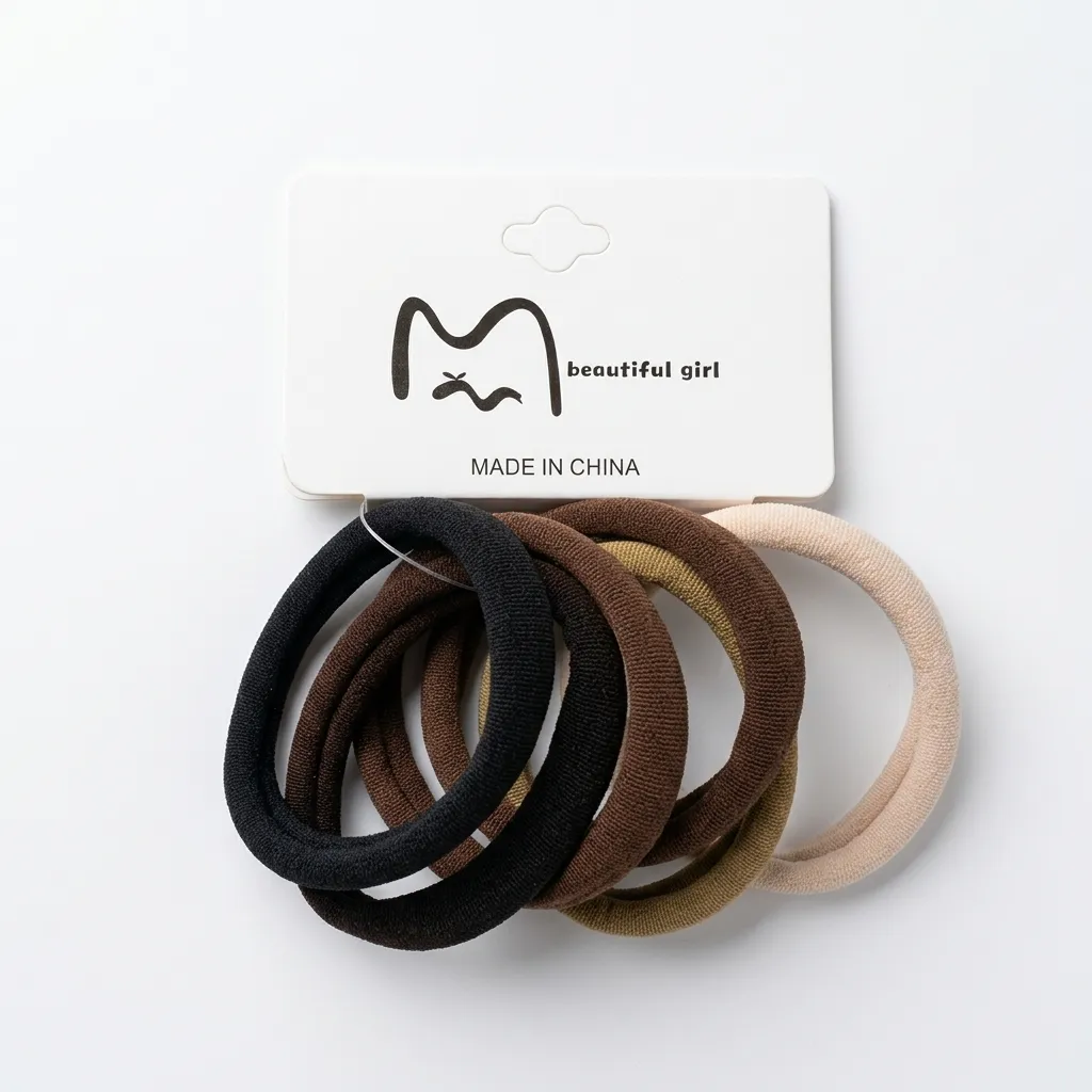 Hand holding neutral color hair ties
