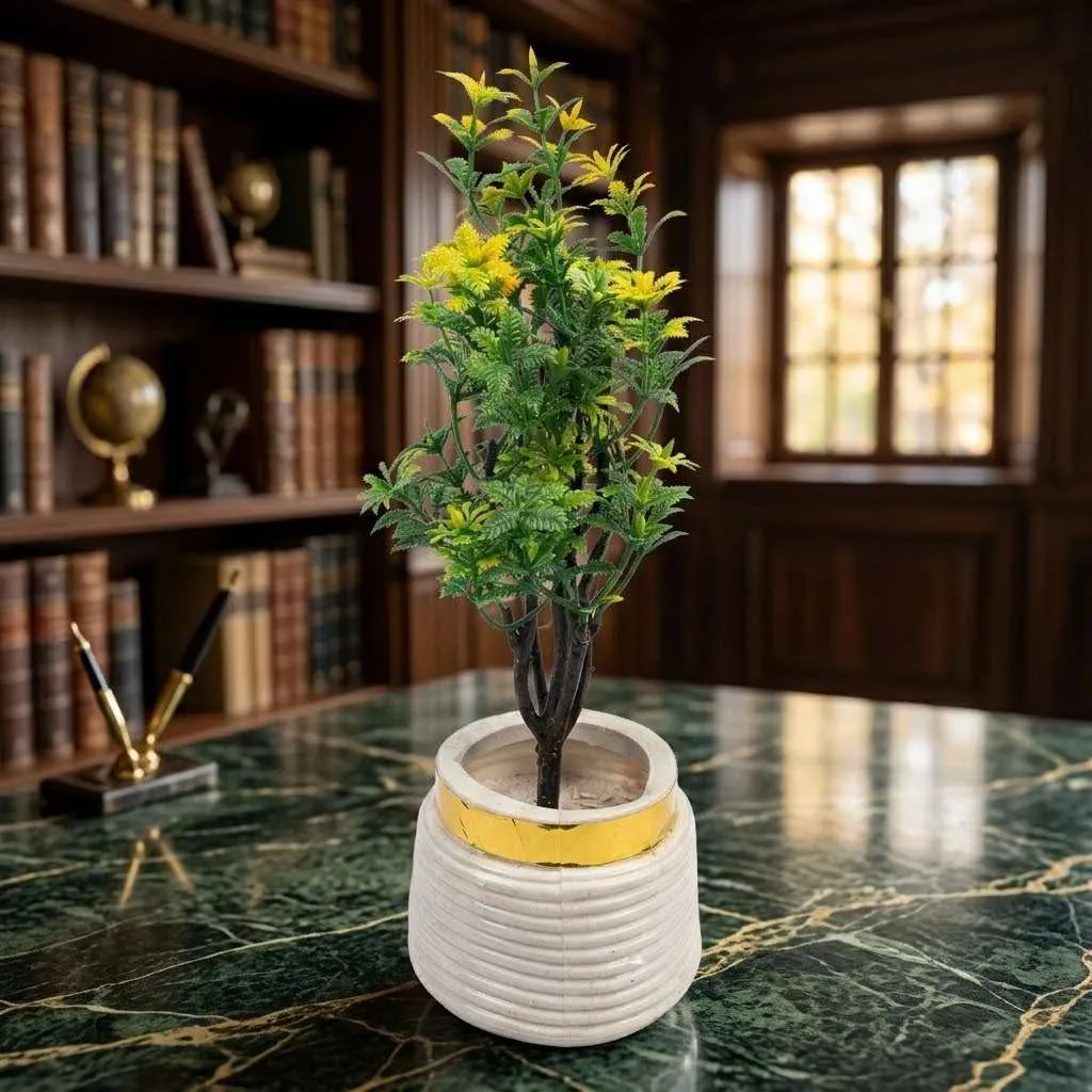 White ribbed ceramic pot with gold band detail